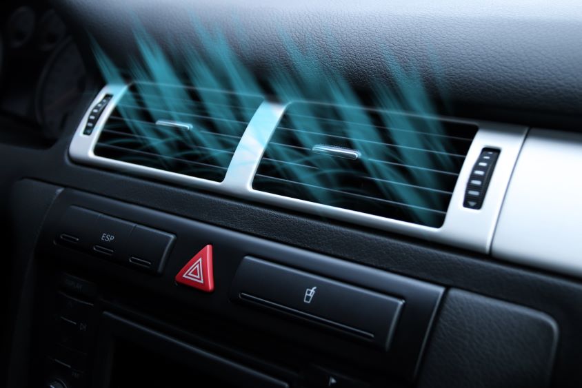 Air condition on car dashboard with graphics indicating cold air blowing