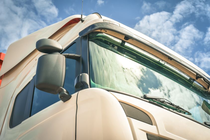 Close up of white HGV exterior on sunny day