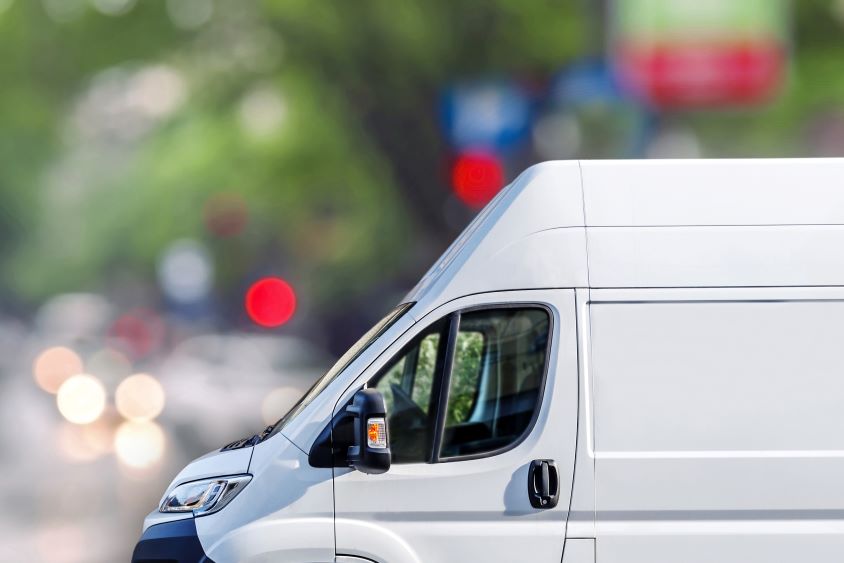 White van with road in background