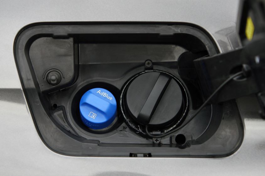 Fuel inlet with adblue plug