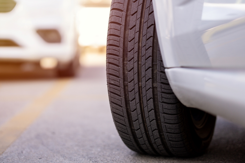 Tire of a grey car turning right