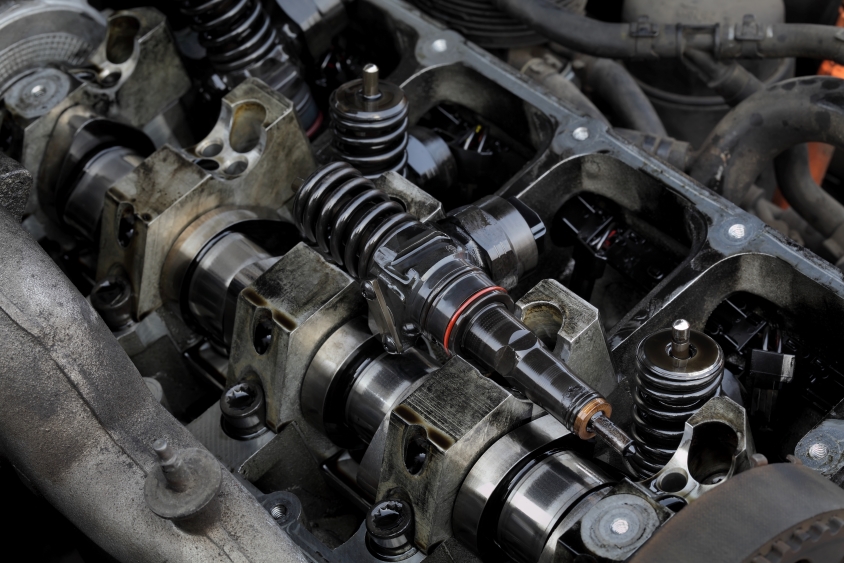 Close up of a car engine in need of repair