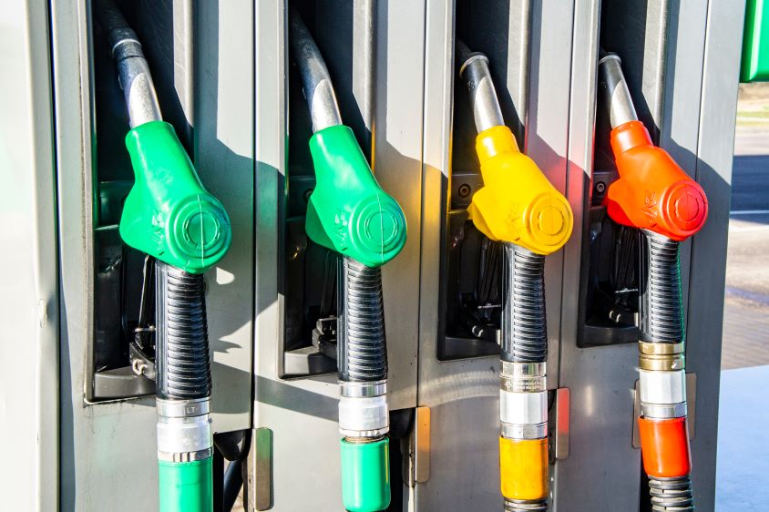 Colourful fuel pumps in holders