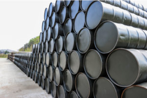 Image of several barrels of crude oil lined up