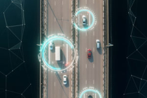 Aerial view of cars on motorway with data overlay