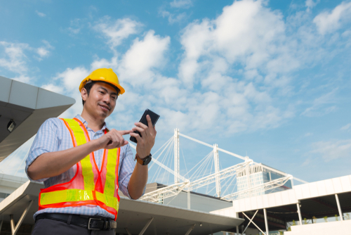 Fleet manager completing vehicle checks on app