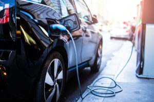 Plug-in electric car being charged at on-street charging point