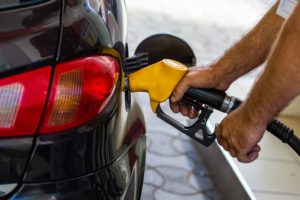 Man's hand refuelling car