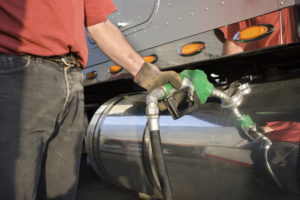 Man filling up an HGV with diesel