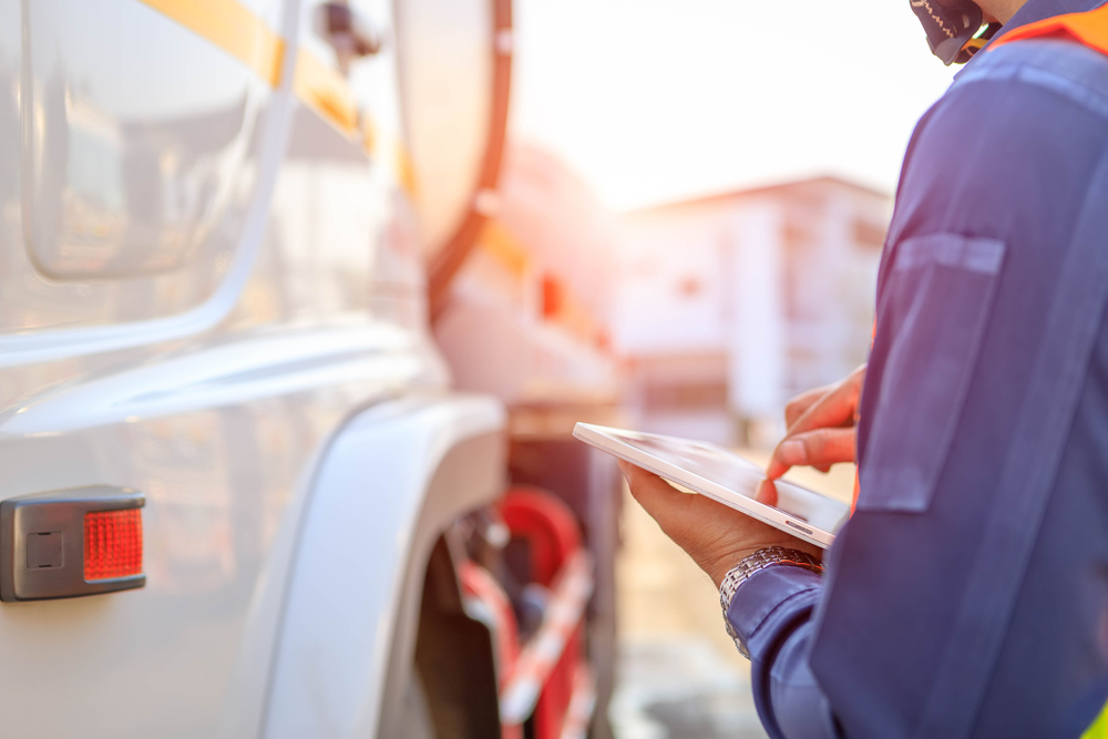 Truck Drivers Hand Holding Tablet Checking Stock Photo