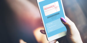 Smartphone showing reward card graphic