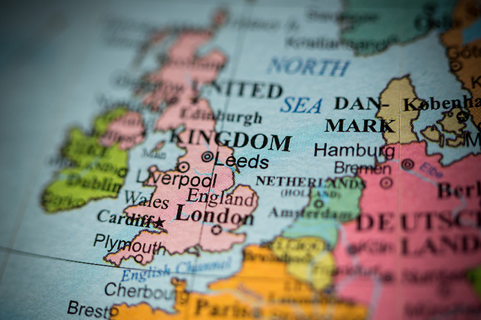 Close up image of a globe showing the UK, coloured in pink, and Europe