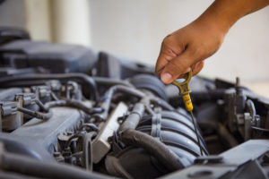 Testing vehicle fluid levels with dipstick