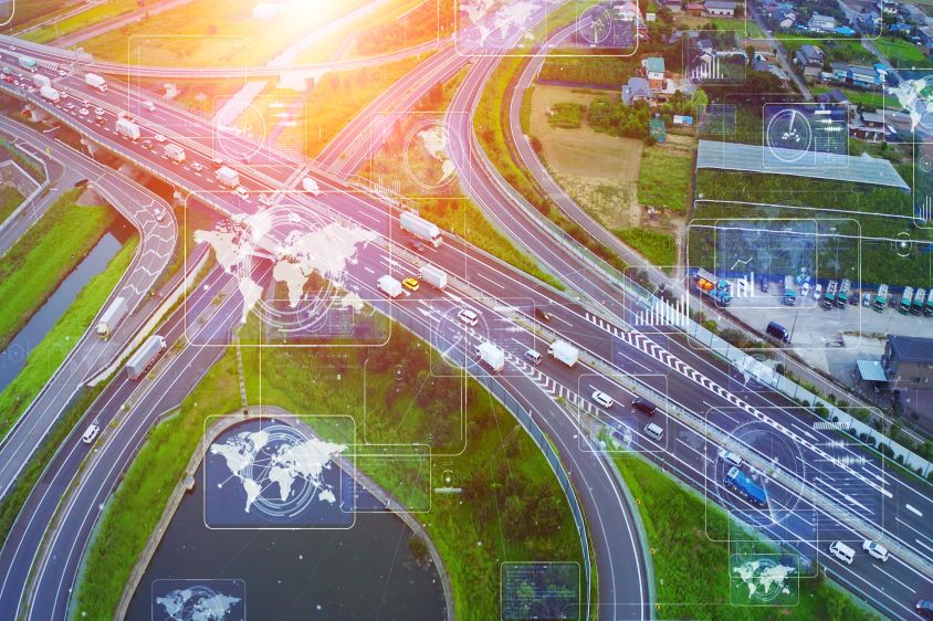 Bird's eye view of motor way with telematics data monitoring vehicles