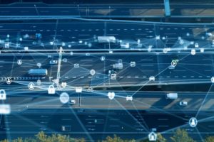 Birds eye view of road showing telematics connecting the vehicles