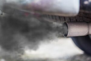 A cloud of exhaust fumes being emitted by a car.