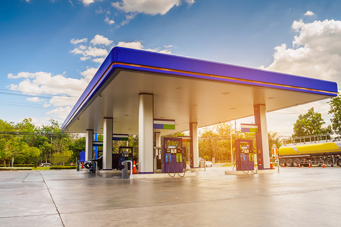 A picture of a petrol station against a sunny sky