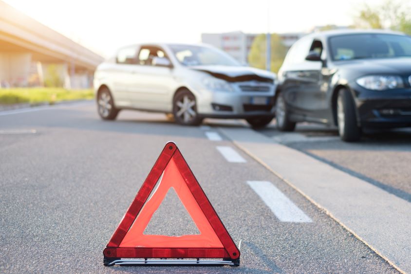 Warning triangle placed on road at scene of accident