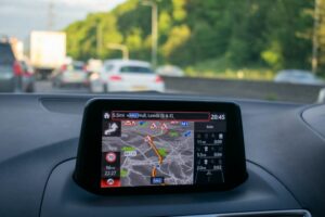 GPS navigation system on car dashboard showing roadworks