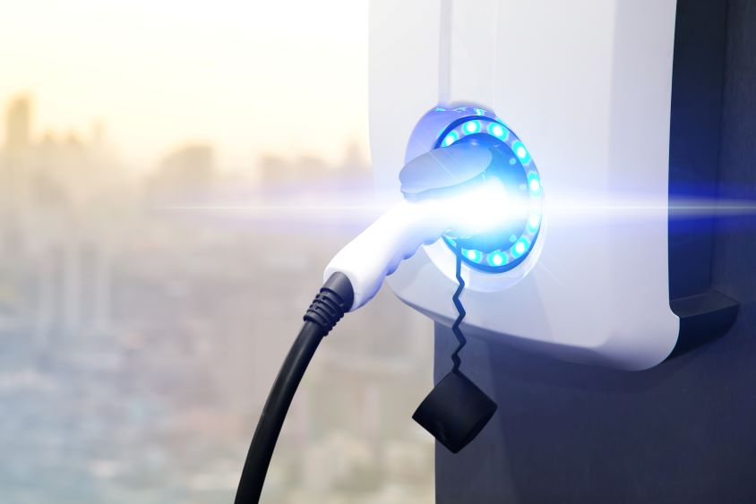 Electric vehicle charger with blue glow