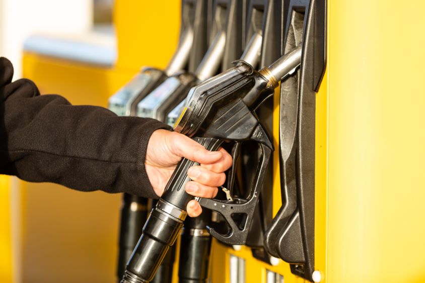 Male hand pulling fuel pump out of socket