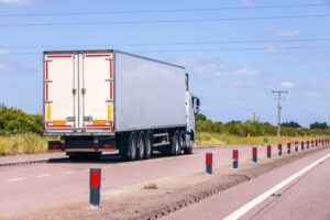 White lorry driving on UK road