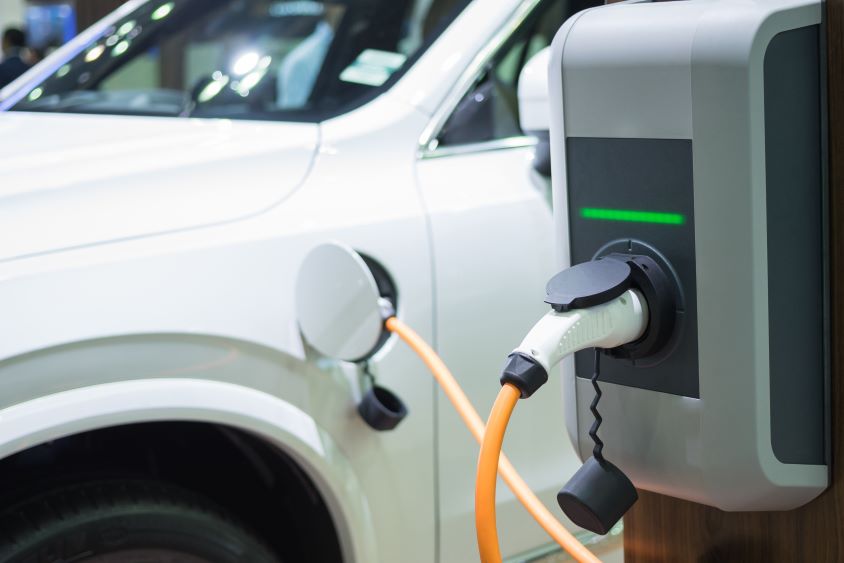 Electric charge point, charging a white electric car