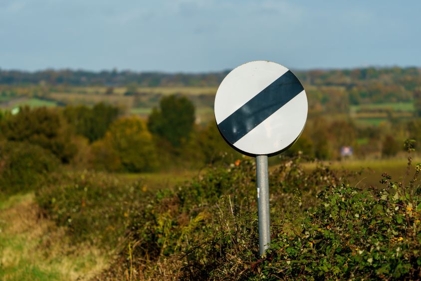 UK national speed limit sign in countryside