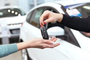 Salesperson handing over keys