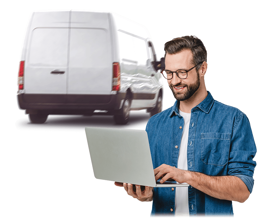 Man on laptop using FleetCheck with van in background