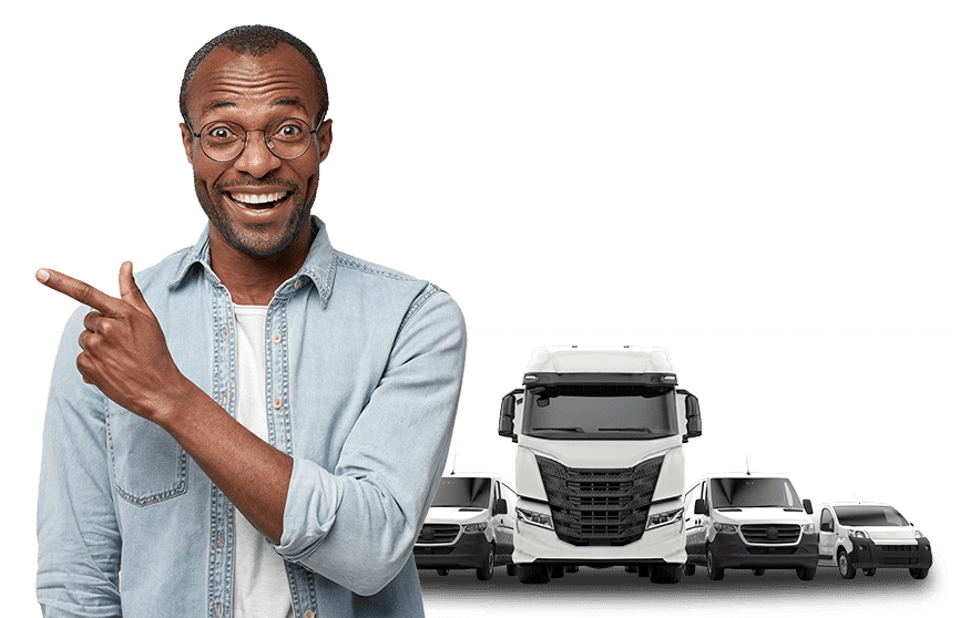 Happy man pointing in front of fleet of vehicles