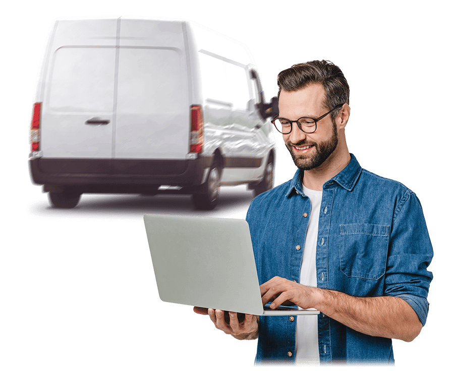 Man on laptop using FleetCheck with van in background