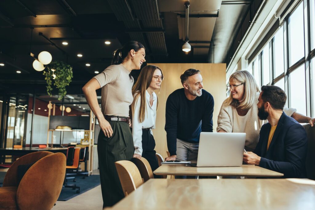 Group of office workers collaborating around a table